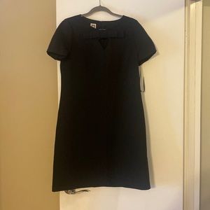 Brand new, black dress, short length. Bow detail at neckline.